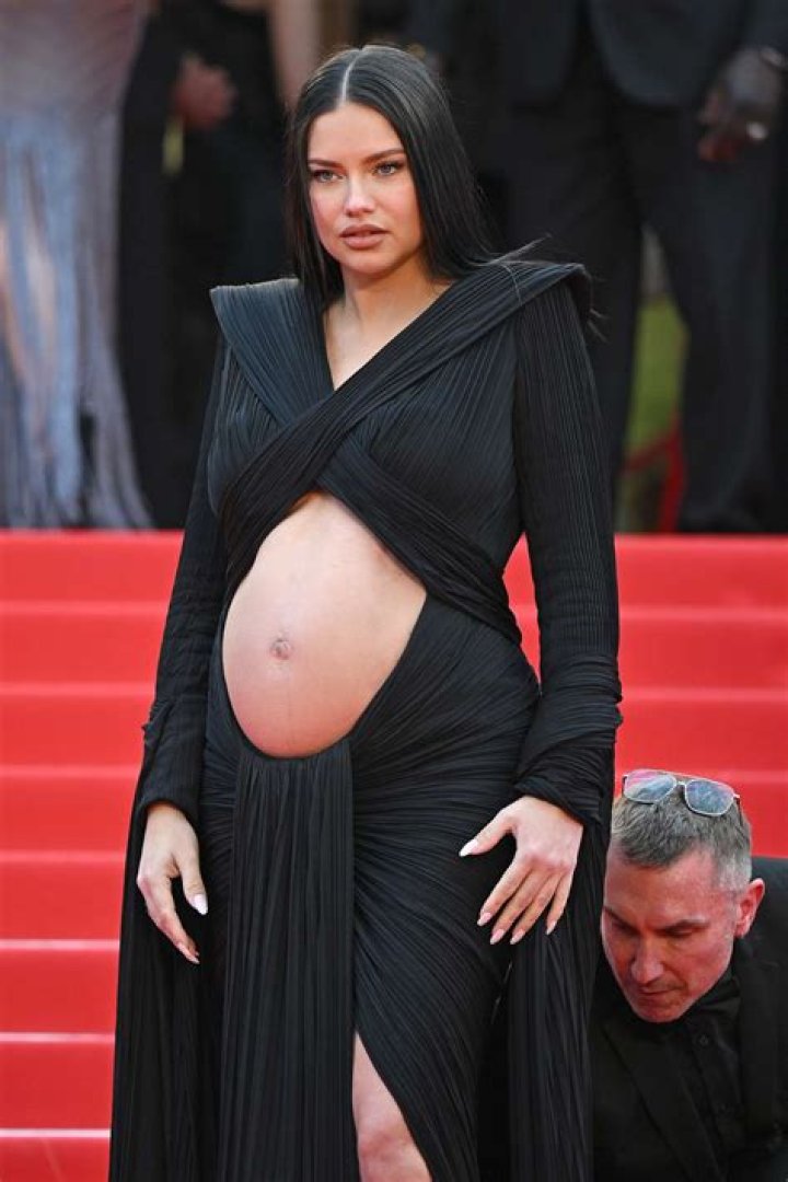 Adriana Lima, 40, Shows Off Bare Baby Bump In Sexy Cutout Dress On Runway: Photos