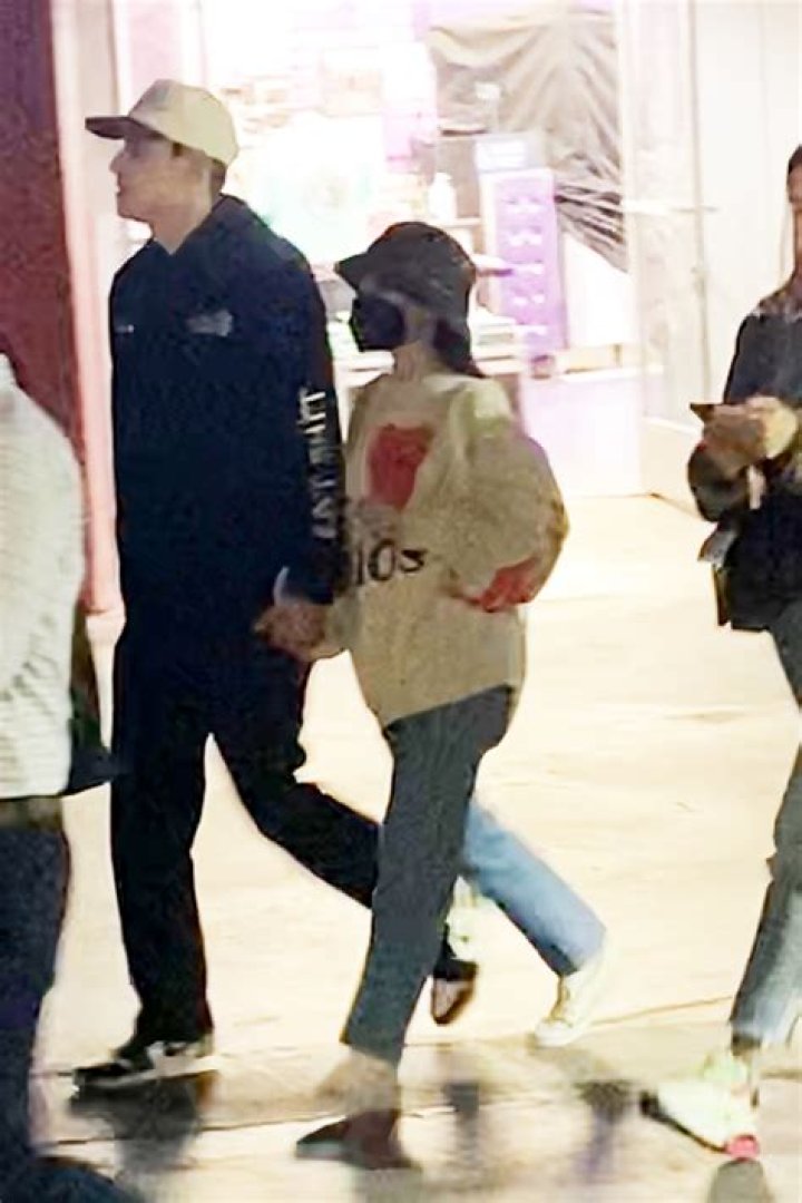 Ariana Grande & Dalton Gomez Hold Hands At Six Flags In 1st Public Photos Since Tying The Knot