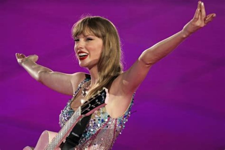 Travis Kelce & Taylor Swift Kiss as He Supports Her at Eras Tour Show in Sydney